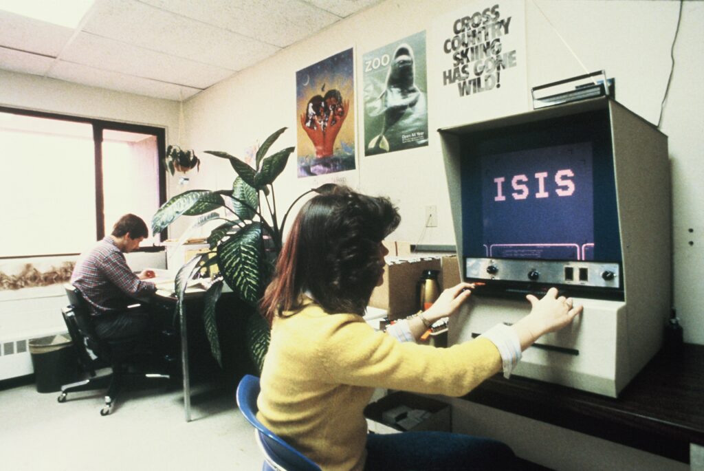 Person using a microfiche reader